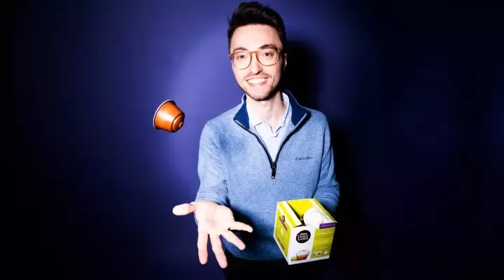 man throwing coffee capsule